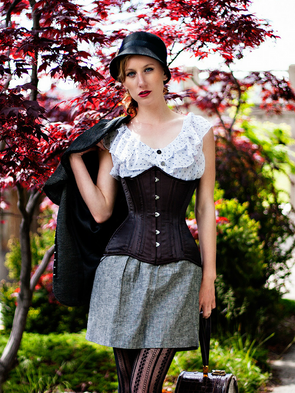Model wearing our 426 longline in black satin with a grey skirt