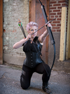 Archery model wearing our underbust 426 longline steel boned black leather corset lingerie