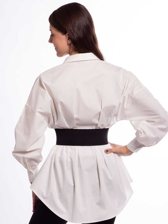 Model in a white shirt and black leggings wearing a steampunk style corset belt with stainless buckles back view