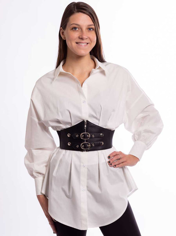 Model in a white shirt and black leggings wearing a steampunk style corset belt with stainless buckles