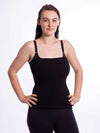 Front view of a model wearing the black longline bamboo liner in an overbust style for corset tops